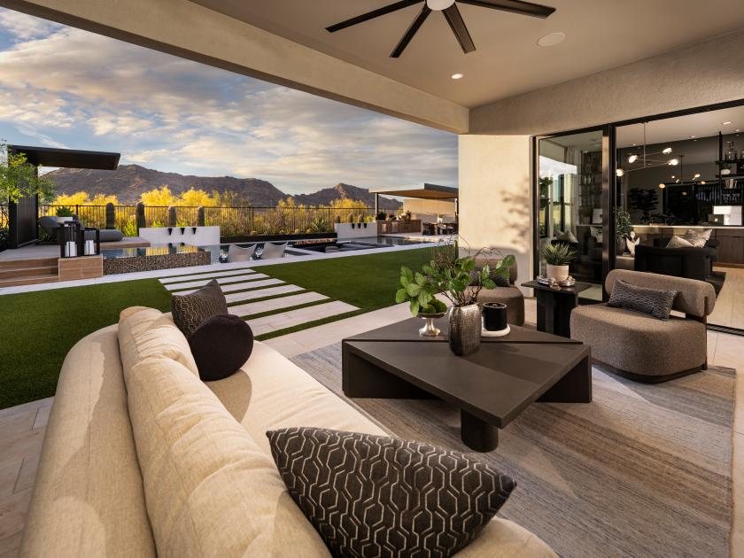 Indoor-outdoor patio living space at a Saddleback Ranch home with mountain views